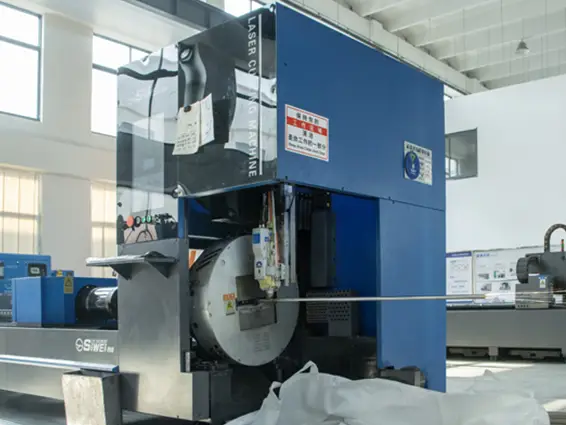 Laser tube cutting machine at SLHER factory for custom metal parts manufacturing