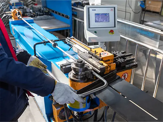Pipe bending machine at SLHER factory for custom metal parts manufacturing